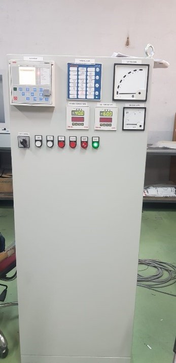 A white panel with buttons and switches
Description automatically generated