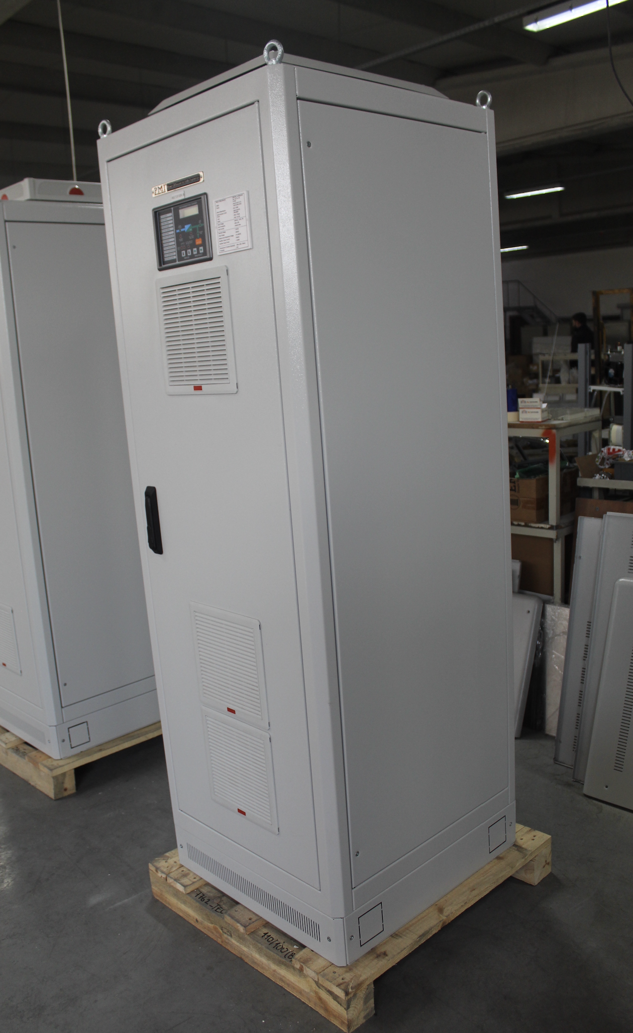 A large white cabinet with a black handle
Description automatically generated