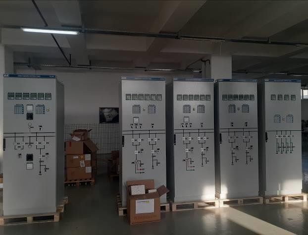 A group of boxes in a room
Description automatically generated